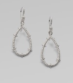 From the Calypso Collection. Spiky open teardrops with white sapphire accents hang from richly ribbed wires in this shining design.White sapphireRhodium platedLength, about 2Ear wireImported