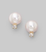 From the Akoya Collection. Classic white cultured pearl studs with sparkling diamond accents set in 18k gold. 6mm white round cultured pearls Diamonds, 0.06 tcw 18k yellow gold Post back Imported