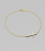 A gleaming 14k gold cross on a delicate chain.14k yellow gold Length, about 7 Pendant length, about ¾ Spring ring clasp Made in USA