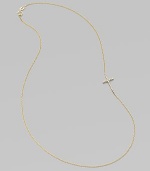 A wispy chain of 14k yellow gold features a cross pendant, encrusted in sparkling diamonds, set askew for a modern edge.Diamonds, .14 tcw 14k yellow gold Length, about 16 Pendant length, about ½ Spring ring clasp Made in USA