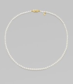 A single strand of luminous pearls with signature clasp closure.4mm white cultured pearls 18K yellow gold Length, about 16 Minuette clasp closure Imported 