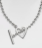 An open heart, etched with the Gucci name, on a bold ball chain with toggle closure, crafted of polished sterling silver. Sterling silver Chain length, about 16¼ Pendant length, about ¾ Toggle closure Made in Italy