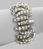 Bold, open arcs set with shimmering faceted Swarovski crystals.CrystalSilverplatedWidth, about 1Length, about 6½Hidden magnetic claspMade in Italy