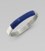 A modern, square-edged bangle of brushed aluminum, with a colorfully wrapped rich leather cord.LeatherAluminumDiameter, about 2¾Imported