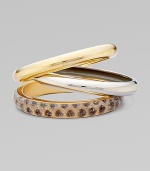 A bold set of 14k plated metal and resin covered bangles to stack along the wrist.Resin covered skin 14k plated Total width, about 2½ Made in USA Please note: Pattern may vary. 