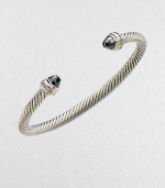 From the Cable Collection. Two beautifully, faceted hematite stone caps accented with dazzling diamonds on a sterling silver cable cuff. HematiteDiamonds, .2 tcwSterling silverDiameter, about 2½Slip-on styleImported 