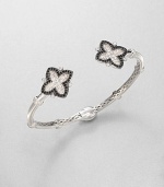 From the Soho Collection. This narrow design features white sapphire and black spinel accented clover-shaped end caps. White sapphiresBlack spinelSterling silverLength, about 7.5Slip-on styleImported 