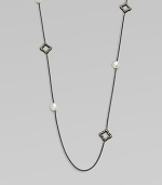 From the Midnight Pearl Collection. This lovely style features diamond accents, quatrefoils and lustrous pearl stations on a sleek, blackened sterling silver box chain. Blackened sterling silverWhite cultured South Sea pearlsDiamonds, .6 tcwLength, about 40Toggle closureImported 