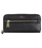 Going places? Bring along this posh, travel-ready wallet from Cole Haan that's the right reserve for all your riches. Luxe leather is adorned with shiny custom hardware, while the interior is outfitted with plenty of pockets and compartments.