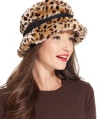 Call of the wild. Add something exotic to your everyday style with this this fun faux fur hat, featuring posh leopard-print and buckle accent. From nine West.