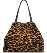 Make a fierce fashion statement with this alluring animal print shopper from DKNY. The elegant contoured design is crafted from come-hither haircalf with soft leather trim and golden hardware detail, making it this season's essential savage beauty.