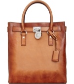 A classic design with artisanal appeal, this undecidedly exquisite tote from MICHAEL Michael Kors is an absolute essential. Butter-soft, dyed leather lends a laid-back look, while the lleaming signature hardware gives the bag posh appeal.