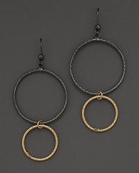 Striking, elegant hoops of black and yellow gold. By Lana.