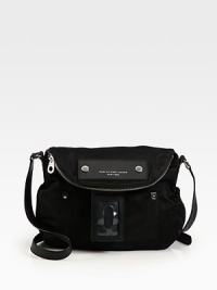 A slouchy flap design crafted of sturdy nylon with leather trim, finished with an over-sized luggage tag.Adjustable shoulder strap, 18-21 dropMagnetic flap closure with top zip compartmentOne outside open pocketOne inside zip pocketTwo inside open pocketsNylon lining11½W X 11H X 3¼DImported