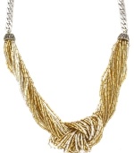 'Tis the season to twinkle! Jessica Simpson's chic knotted necklace combines multiple strands of acrylic beads in shimmery gold and silver hues. Set in silver tone mixed metal. Approximate length: 17 inches.