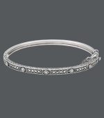 Add a slice of style with this thin, slip of a bangle. Genevieve & Grace's design highlights an intricate pattern that shines with the addition of glittering marcasite accents. Crafted in sterling silver. Approximate diameter: 2-1/2 inches.