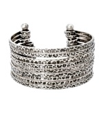 Go for a look that's completely retro-fitted. Vintage-inspired color creates a look of effortless cool in textured, oxidized silver tone mixed metal. Open cuff design slips easily over the wrist. Approximate diameter: 1-1/2 inches.