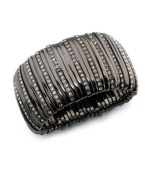 With this stunning bracelet from Alfani, you'll be decked out in Art Deco style. Crafted in hematite tone mixed metal with sparkling glass stones, its stretch design makes it effortless to wear. Approximate diameter: 2 inches.