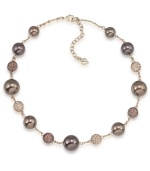 Lightweight yet luxe. Carolee's illusion necklace will have an elegant effect on your fall wardrobe. Made in gold tone mixed metal, it's adorned with glass pearls in a beautiful brown hue as well as sparkling fireball accents. Approximate length: 16 inches + 2-inch extender.