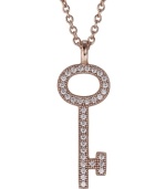 Put your look under lock and key. CRISLU's mini key pendant sparkles with the addition of round-cut cubic zirconias (1/3 ct. t.w.) set in polished 18k gold over sterling silver. Approximate length: 16 inches + 2-inch extender. Approximate drop: 1 inch.