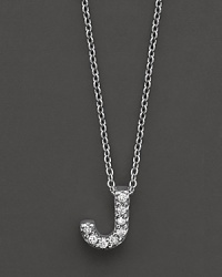 From the Tiny Treasures collection, a diamond J necklace. With signature ruby accent. Designed by Roberto Coin.