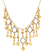 Highlight your neckline in rich, golden hues. Lauren by Ralph Lauren's stunning Kashmir bib necklace features rows of intricate teardrops and cut-out charms. Set in gold tone mixed metal. Approximate length: 16 inches + 2-inch extender. Approximate drop: 1 to 2 inches.