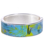 Channel the exoticism and energy of Brasil in Haskell's inspired skinny bangle. The Palm bangle features a blue and green palm leaf print design, set in silver tone mixed metal with a hinge clasp. Approximate diameter: 2-1/2 inches. Approximate length: 8 inches. Item comes packaged in a green gift box.