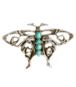 Delicate by design. Let your style take flight in Lucky Brand's intricate butterfly ring. Semi-precious reconstituted calcite turquoise stones decorate the center of a dainty open work pattern. Set in mixed metal. Size 7.