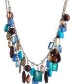 Perfect your party look. Haskell's Brasilian-themed drama necklace combines a wild mix of blue, brown and taupe beads in acrylic, metal and wood. Set in brass-plated mixed metal. Approximate length: 17 inches + 3-inch extender. Approximate drop: 1-1/2 inches.