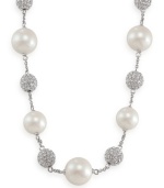 Carolee creates an icy illusion with this stunning necklace. Glass pearls and crystal-accented fireballs alternate on a chain crafted of imitation rhodium-plated mixed metal. Approximate length: 16 inches + 2-inch extender.