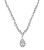 Look simply luminous in this glittering glass stone pendant by Carolee. Crafted in silver tone mixed metal. Approximate length: 16 inches + 2-inch extender. Approximate drop: 1-1/2 inches.