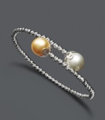 Wrap your wrists in elegant style. Bracelet features a wrapped cuff design with cultured Golden South Sea pearls (9-10 mm) at the ends and sparkle bead accents. Crafted in sterling silver. Approximate length: 7-1/2 inches.