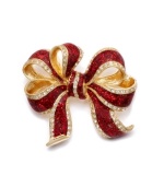 Wrap up your look! Add instant Christmas Cheer with Charter Club's vibrant ribbon pin. Crafted in gold tone mixed metal, brooch features glittery red enamel and sparkling crystal accents. Item comes packaged in a signature gift box. Approximate size: 2 inches.