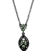 Geometric effect. A chic marquise-shaped pendant sets apart this striking necklace from Givenchy. Crafted in hematite tone mixed metal, it's embellished with sparkling glass accents in a pretty pale green hue. Approximate length: 16 inches + 2-inch extender. Approximate drop: 1 inch.