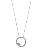 Eternal design accented by just the right amount of sparkle. 2028 pendant features a cut-out circular style accented by a chic flower and acrylic stones. Setting and chain crafted in silver tone mixed metal. Approximate length: 16 inches + 3-inch extender. Approximate drop: 1-1/4 inches.