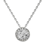 Subtle sparkle for the savvy fashionista. Swarovski's chic circular pendant features a round-cut crystal center stone surrounded by a halo of glittering crystals. Setting and chain crafted in silver tone mixed metal. Approximate length: 15 inches. Approximate drop: 3/4 inches.