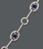 Look your absolute best in this stunning accessory. Victoria Townsend's regal-looking bracelet highlights oval-cut sapphires (2 ct. t.w.) and diamond-accented circular and oval links. Crafted in 18k gold over sterling silver. Approximate length: 7 inches.