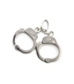 Rembrandt's handcuffs charm pays tribute to the hard work and dedication of law enforcement professionals. Made in sterling silver. Approximate drop: 1 inch.