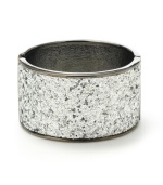 Shimmering and stunning. A silver glitter finish adds a glamorous touch to Haskell's wide bangle bracelet. Crafted in hematite tone mixed metal with a hinge closure. Approximate length: 7-1/2 inches.