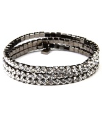 Good things happen in threes! Featuring a triple-row silhouette, Givenchy's gorgeous link bracelet is embellished with glittering glass accents. and crystals. Wear it day or night as a dazzling decorative detail. Made in hematite tone mixed metal. Approximate length: 7-1/4 inches.