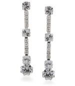 Give your image a little extra twinkle. These dramatic drop earrings by Carolee feature four large, round-cut crystals with eight round-cut crystal accents. Crafted in silver-plated mixed metal with surgical steel posts. Approximate drop: 1-1/2 inches.