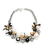 Start a conversation with this bold statement piece. Necklace by Betsey Johnson flaunts sparkly fireballs, acrylic pearls, black beads, ribbons, and crystal-accented rosebuds simultaneously. Crafted in antique gold and silver tone mixed metal. Approximate length: 20 inches.