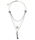 Sweet layers of femininity for the blossoming fashionista. Another innovative design by Betsey Johnson - necklace features ribbon accents with a sparkling strand of crystal, a crystal coated heart charm, and a black-plated crystal key. Necklace crafted in antique silver tone mixed metal. Approximate length: 16 inches + 3-inch extender. Approximate drop: 1-3 inches.