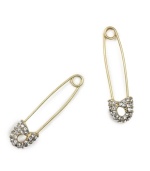 Never play it safe when it comes to sporting great style. These edgy safety pin earrings by RACHEL Rachel Roy feature sparkling crystal ends set in gold tone mixed metal. Approximate drop: 1-1/2 inches.