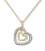 Take the classic heart pendant to a whole new level with Swarovski's chic, double heart design. Two open-cut hearts and chain crafted in gold tone mixed metal with sparkling crystal accents. Approximate length: 15 inches. Approximate drop: 1-1/4 inches.