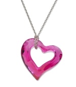 Add a lovely look in hot pink style. Swarovski's love heart pendant features a fuchsia crystal with a chic open-cut design. Setting and wrapped chain crafted in silver tone mixed metal. Approximate length: 15 inches. Approximate drop: 1 inch.