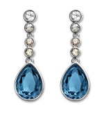 True blue: Made in silver tone mixed metal, Swarovski's Meringue Montana crystal and rhinestone earrings are an elegant finishing touch for your wardrobe. Approximate drop: 1-3/8 inches.