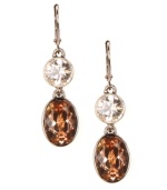 With glittering crystals in clear and rich golden brown hues, Givenchy's double-drop baguette earrings will be an attractive accompaniment for your fall wardrobe. Crafted in gold tone mixed metal. Approximate drop: 2 inches.