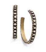 Traditional hoops take a glamorous turn in Bar III's unique style. These three-quarter hoops incorporate both vintage appeal and shine with sparkling clear crystals and hematite tone mixed metal. Approximate diameter: 1-7/8 inches.