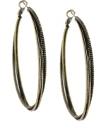 Add a stylish twist. The antique gold tone mixed metal setting on BCBGeneration's unique twisted hoop earrings give them a rustic look and feel. Approximate diameter: 2 inches.